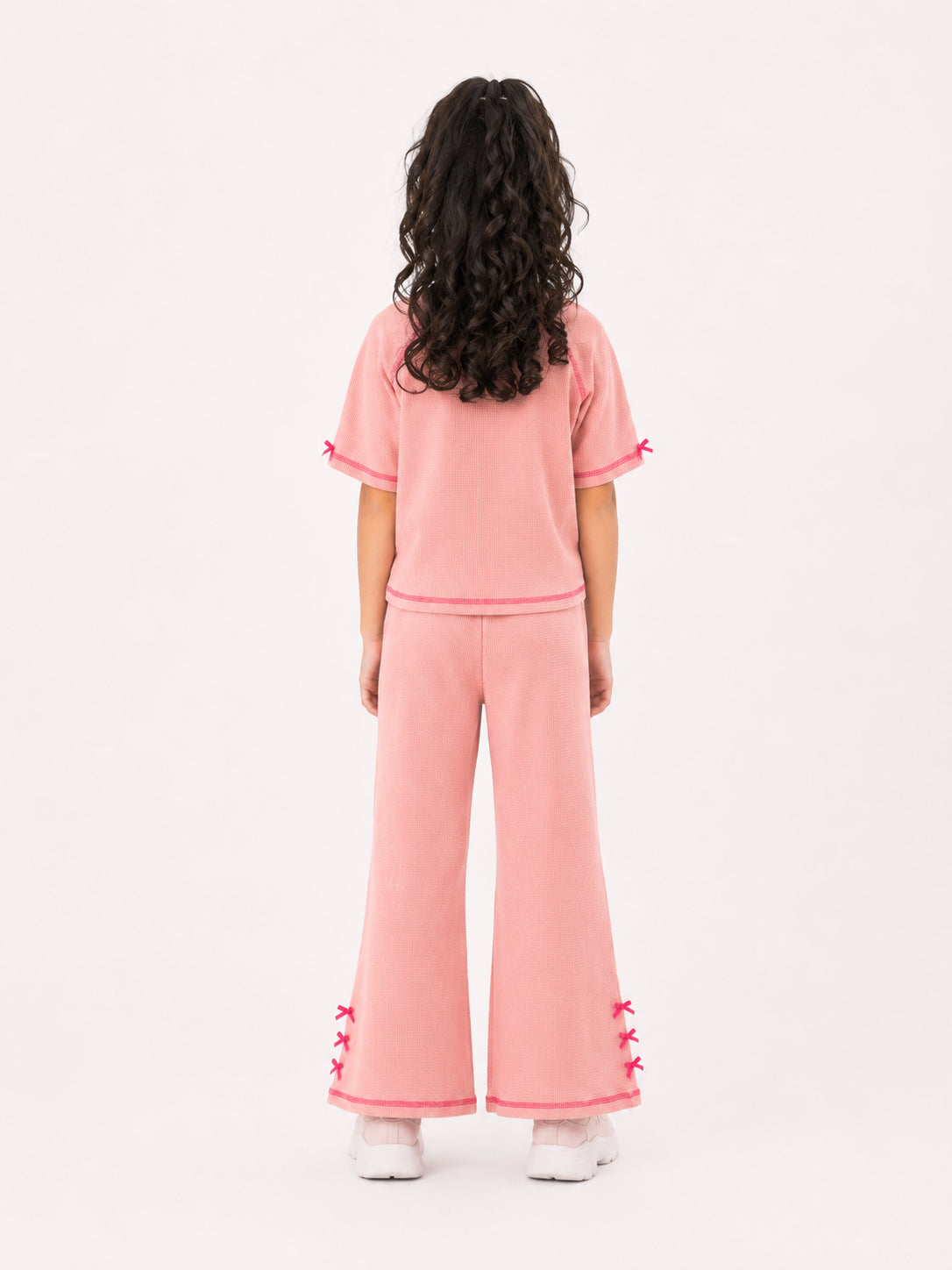 Girls bow-accented waffle co-ord set by Juniors.pk
