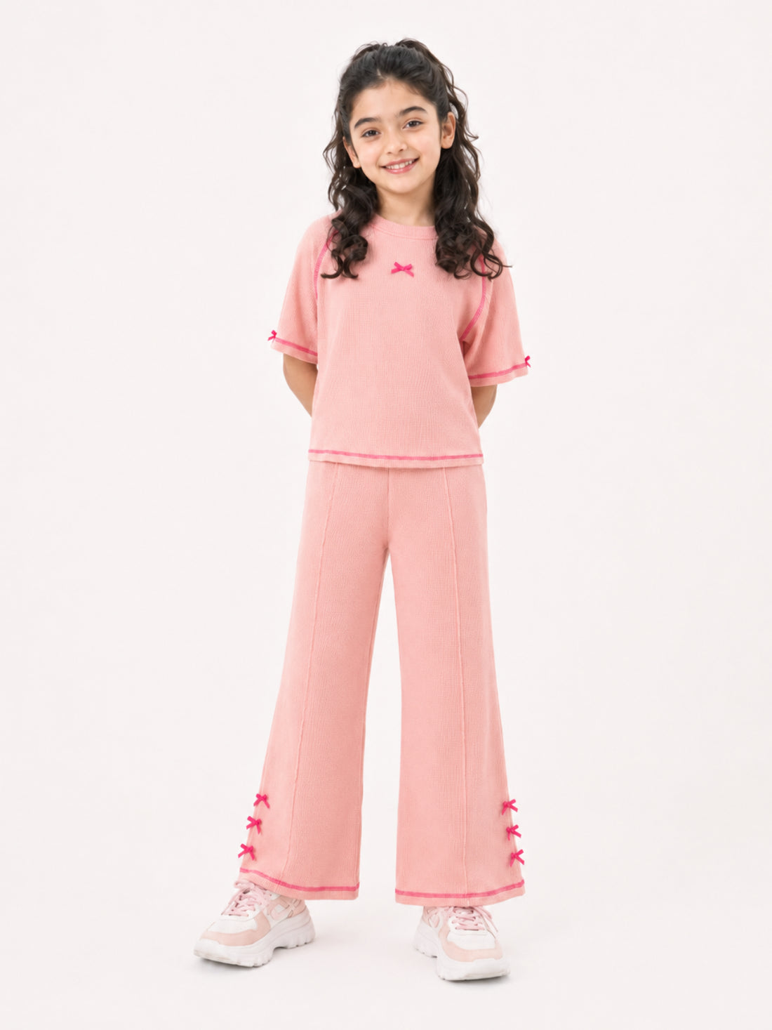Girls bow-accented waffle co-ord set by Juniors.pk