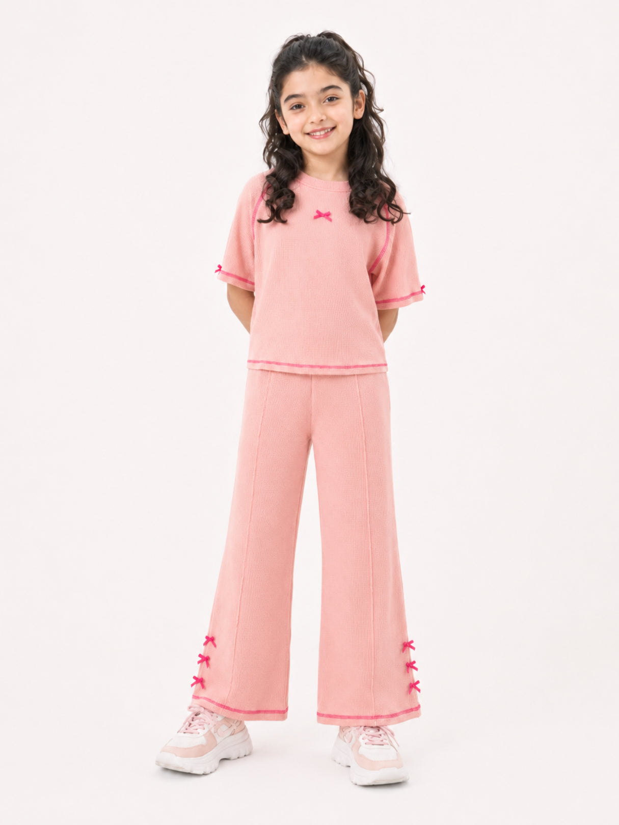 Girls bow-accented waffle co-ord set by Juniors.pk